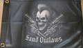 Flag with a skull holding guns and 'Sand Outlaws' text on a dark background