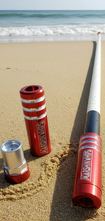 Single Red Game Changer Whip on a sandy beach with ocean waves in the background