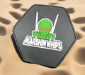 Hexagonal patch with an alien design and 'Marshin Whips' text on a black background