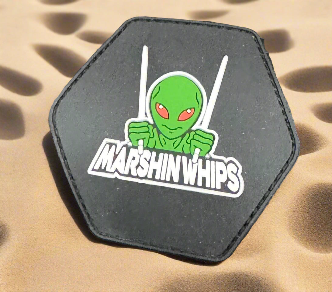 Hexagonal patch with an alien design and 'Marshin Whips' text on a black background
