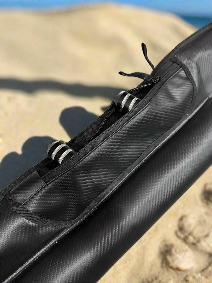 Black carbon fiber rod case on a textured surface