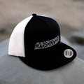 Black and white cap with 'MARSHIN WHIPS' logo on a blurred background
