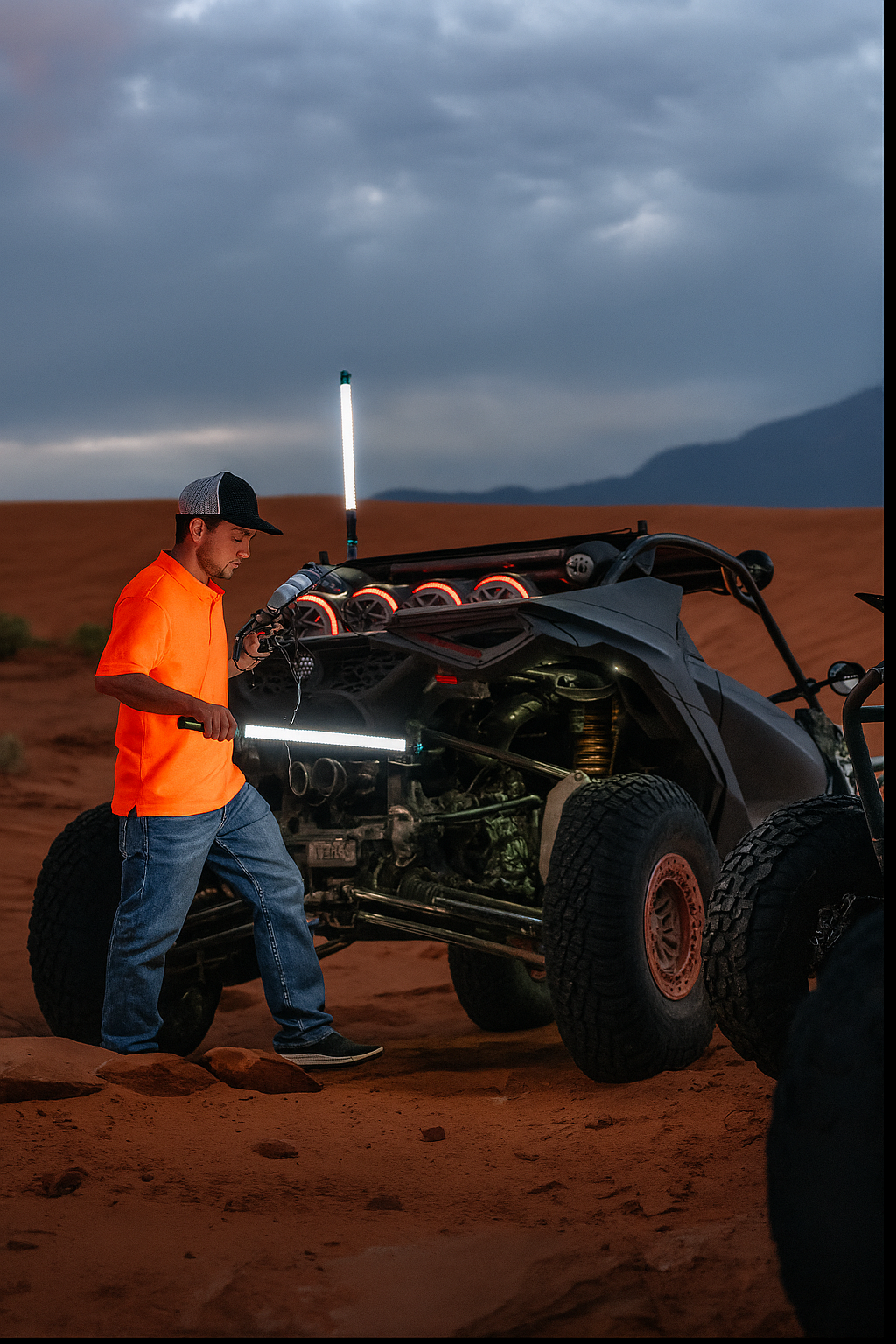 A person holding a work light next to a UTV as an alternative light source