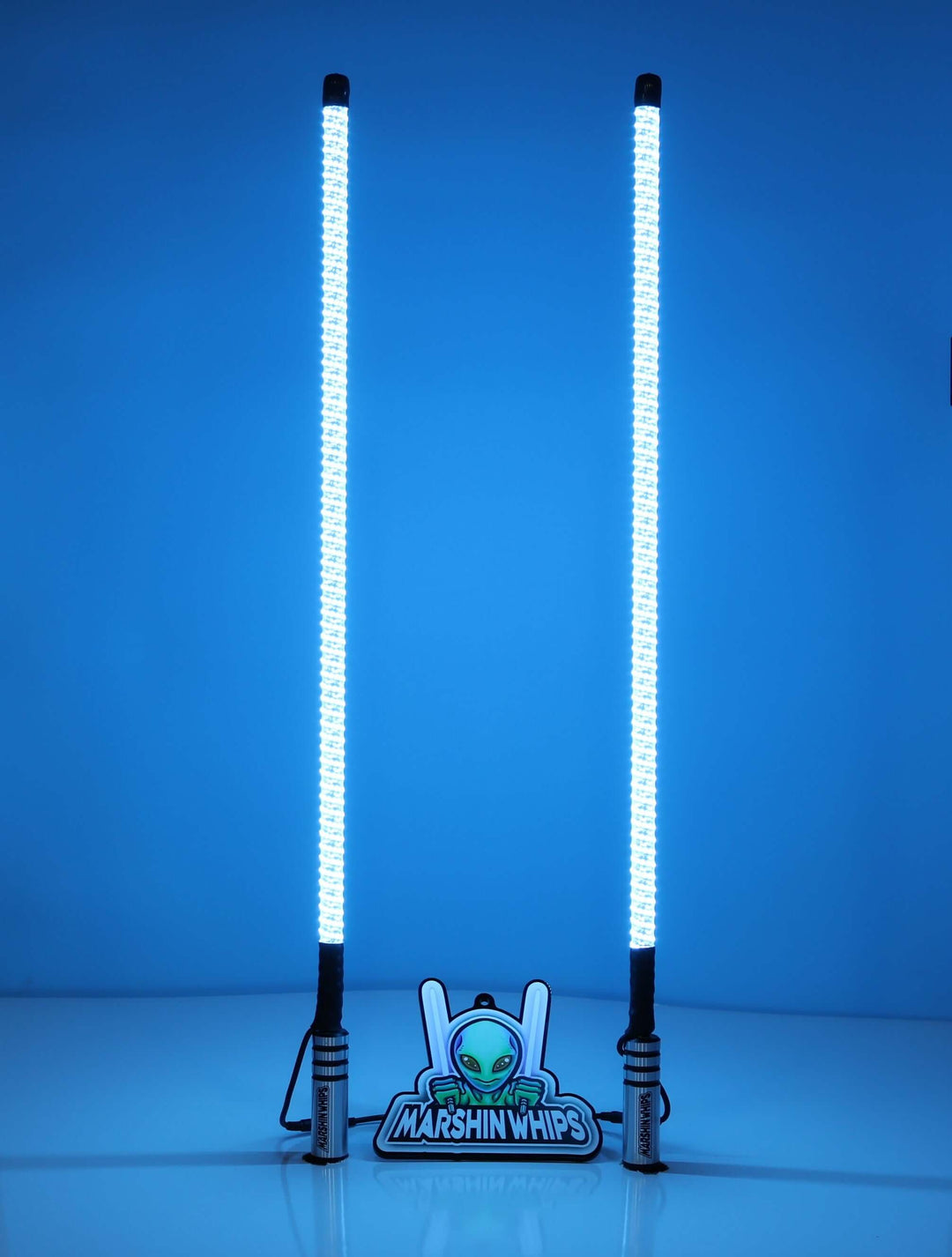 Two glowing light whips on a blue background with an 'Alien Marshin Whips' logo below.